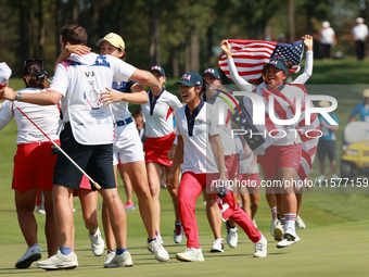 GAINESVILLE, VIRGINIA - SEPTEMBER 15: Team USA players celebrates after winning the Solheim Cup at Robert Trent Jones Golf Club on Sunday, S...