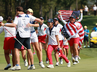 GAINESVILLE, VIRGINIA - SEPTEMBER 15: Team USA players celebrates after winning the Solheim Cup at Robert Trent Jones Golf Club on Sunday, S...