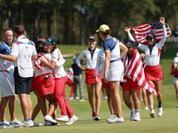 GAINESVILLE, VIRGINIA - SEPTEMBER 15: Team USA players celebrates after winning the Solheim Cup at Robert Trent Jones Golf Club on Sunday, S...