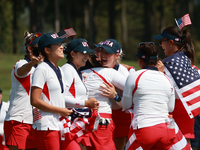 GAINESVILLE, VIRGINIA - SEPTEMBER 15: Team USA players celebrates after winning the Solheim Cup at Robert Trent Jones Golf Club on Sunday, S...