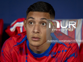 Nahuel Molina of Atletico de Madrid sits on the bench during the La Liga EA Sports 2024/25 football match between Atletico Madrid and Valenc...