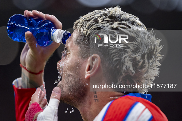 Rodrigo De Paul of Atletico de Madrid hydrates before the La Liga EA Sports 2024/25 football match between Atletico Madrid and Valencia CF a...