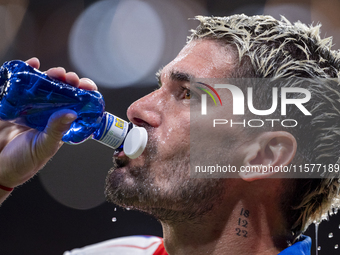 Rodrigo De Paul of Atletico de Madrid hydrates before the La Liga EA Sports 2024/25 football match between Atletico Madrid and Valencia CF a...