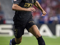 Dani Gomez of Valencia CF is in action with the ball during the La Liga EA Sports 2024/25 football match between Atletico Madrid and Valenci...