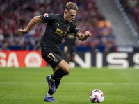 Dani Gomez of Valencia CF is in action with the ball during the La Liga EA Sports 2024/25 football match between Atletico Madrid and Valenci...