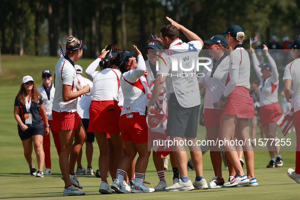 GAINESVILLE, VIRGINIA - SEPTEMBER 15: Team USA players celebrates after winning the Solheim Cup at Robert Trent Jones Golf Club on Sunday, S...