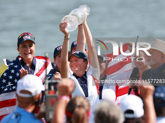 GAINESVILLE, VIRGINIA - SEPTEMBER 15: Captain Stacy Lewis of the United States holds up the trophy after winning the Solheim Cup at Robert T...