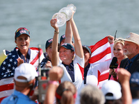 GAINESVILLE, VIRGINIA - SEPTEMBER 15: Captain Stacy Lewis of the United States holds up the trophy after winning the Solheim Cup at Robert T...