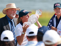 GAINESVILLE, VIRGINIA - SEPTEMBER 15: Captain Stacy Lewis of the United States kisses the trophy after winning the Solheim Cup at Robert Tre...