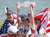 GAINESVILLE, VIRGINIA - SEPTEMBER 15: Captain Stacy Lewis of the United States holds up the trophy after winning the Solheim Cup at Robert T...