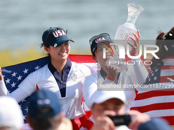 GAINESVILLE, VIRGINIA - SEPTEMBER 15: Lilia Vu of Team USA holds up the trophy after winning the Solheim Cup at Robert Trent Jones Golf Club...