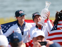 GAINESVILLE, VIRGINIA - SEPTEMBER 15: Lilia Vu of Team USA holds up the trophy after winning the Solheim Cup at Robert Trent Jones Golf Club...