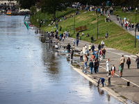 People gathered to watch flood-wave peak after heavy rainfall raised the level of the Vistula River flooding a part of the boulvards in Krak...