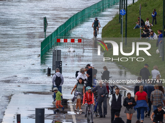 People gathered to watch flood-wave peak after heavy rainfall raised the level of the Vistula River flooding a part of the boulvards in Krak...