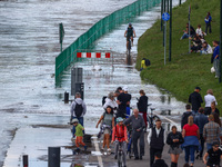 People gathered to watch flood-wave peak after heavy rainfall raised the level of the Vistula River flooding a part of the boulvards in Krak...