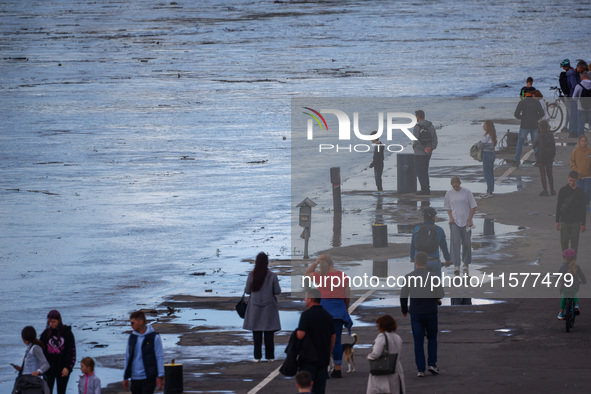 People gathered to watch flood-wave peak after heavy rainfall raised the level of the Vistula River flooding a part of the boulvards in Krak...