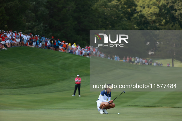 GAINESVILLE, VIRGINIA - SEPTEMBER 15: Celine Boutier of Team Europe lines up her putt on the 15th green during single matches on Day Three o...