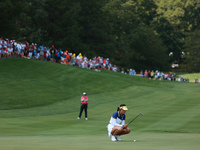 GAINESVILLE, VIRGINIA - SEPTEMBER 15: Celine Boutier of Team Europe lines up her putt on the 15th green during single matches on Day Three o...