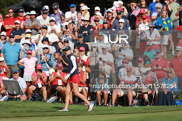 GAINESVILLE, VIRGINIA - SEPTEMBER 15: Nelly Korda of the United States follows her putt on the fourth green during single matches on Day Thr...