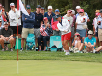 GAINESVILLE, VIRGINIA - SEPTEMBER 15: Megan Khang of the United States chips into the seventh green during single matches on Day Three of th...