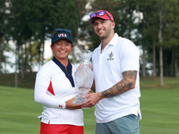 GAINESVILLE, VIRGINIA - SEPTEMBER 15: Megan Khang of the United States poses with her significant other, while holding the trophy on the 18t...