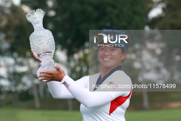 GAINESVILLE, VIRGINIA - SEPTEMBER 15: Megan Khang of the United States poses with the trophy on the 18th green at the conclusion of the Solh...