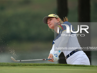 GAINESVILLE, VIRGINIA - SEPTEMBER 15: Emily Kristine Pedersen of Team Europe hits out of the bunker toward the eighth green during single ma...