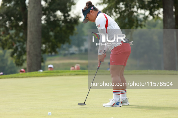 GAINESVILLE, VIRGINIA - SEPTEMBER 15: Megan Khang of the United States follows her putt on the eigh green during single matches on Day Three...