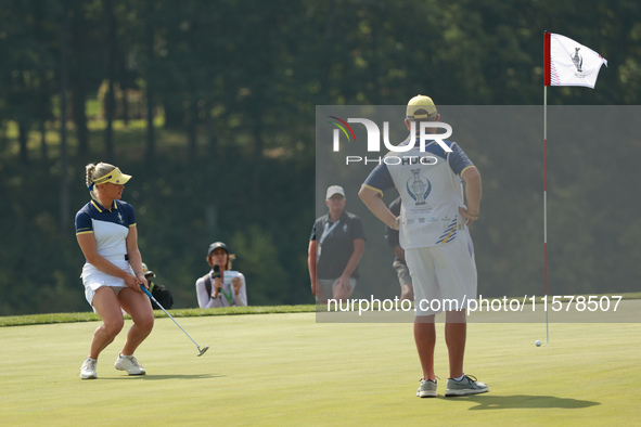 GAINESVILLE, VIRGINIA - SEPTEMBER 15: Charley Hull of Team Europe reacts to her putt on the tenth green during single matches on Day Three o...