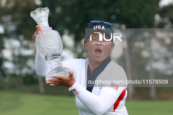 GAINESVILLE, VIRGINIA - SEPTEMBER 15: Megan Khang of the United States poses with the trophy on the 18th green at the conclusion of the Solh...