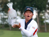 GAINESVILLE, VIRGINIA - SEPTEMBER 15: Megan Khang of the United States poses with the trophy on the 18th green at the conclusion of the Solh...