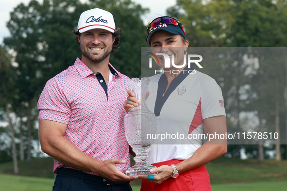 GAINESVILLE, VIRGINIA - SEPTEMBER 15: Lexi Thompson of the United States poses with her significant other, holding the trophy on the 18th gr...