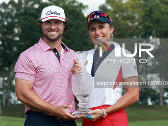 GAINESVILLE, VIRGINIA - SEPTEMBER 15: Lexi Thompson of the United States poses with her significant other, holding the trophy on the 18th gr...