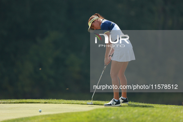 GAINESVILLE, VIRGINIA - SEPTEMBER 15: Georgia Hall of Team Europe follows her putt on the tenth green during single matches on Day Three of...