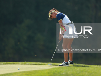 GAINESVILLE, VIRGINIA - SEPTEMBER 15: Georgia Hall of Team Europe follows her putt on the tenth green during single matches on Day Three of...