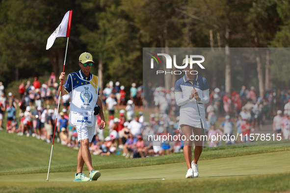 GAINESVILLE, VIRGINIA - SEPTEMBER 15: Celine Boutier of Team Europe reacts to her putt on the 16th green during single matches on Day Three...