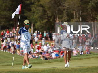 GAINESVILLE, VIRGINIA - SEPTEMBER 15: Celine Boutier of Team Europe reacts to her putt on the 16th green during single matches on Day Three...