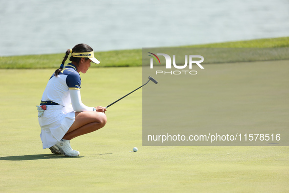 GAINESVILLE, VIRGINIA - SEPTEMBER 15: Celine Boutier of Team Europe lines up her putt on the 18th green during single matches on Day Three o...