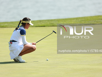 GAINESVILLE, VIRGINIA - SEPTEMBER 15: Celine Boutier of Team Europe lines up her putt on the 18th green during single matches on Day Three o...