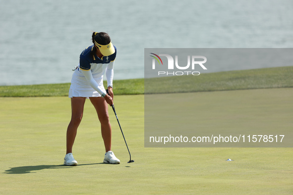 GAINESVILLE, VIRGINIA - SEPTEMBER 15: Celine Boutier of Team Europe follows her putt on the 18th green during single matches on Day Three of...