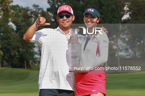 GAINESVILLE, VIRGINIA - SEPTEMBER 15: Alison Lee of the United States poses with her caddie while holding the trophy on the 18th green at th...