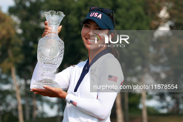 GAINESVILLE, VIRGINIA - SEPTEMBER 15: Alison Lee of the United States poses with the trophy on the 18th green at the conclusion of the Solhe...