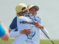 GAINESVILLE, VIRGINIA - SEPTEMBER 15: Celine Boutier of Team Europe celebrates her putt on the 18th green with her caddie during single matc...