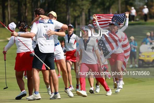 GAINESVILLE, VIRGINIA - SEPTEMBER 15: Team USA players celebrate after winning the Solheim Cup at Robert Trent Jones Golf Club on Sunday, Se...