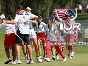 GAINESVILLE, VIRGINIA - SEPTEMBER 15: Team USA players celebrate after winning the Solheim Cup at Robert Trent Jones Golf Club on Sunday, Se...