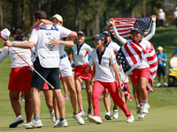 GAINESVILLE, VIRGINIA - SEPTEMBER 15: Team USA players celebrate after winning the Solheim Cup at Robert Trent Jones Golf Club on Sunday, Se...