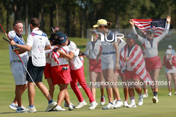 GAINESVILLE, VIRGINIA - SEPTEMBER 15: Team USA players celebrate after winning the Solheim Cup at Robert Trent Jones Golf Club on Sunday, Se...