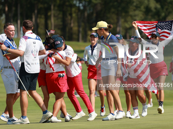 GAINESVILLE, VIRGINIA - SEPTEMBER 15: Team USA players celebrate after winning the Solheim Cup at Robert Trent Jones Golf Club on Sunday, Se...