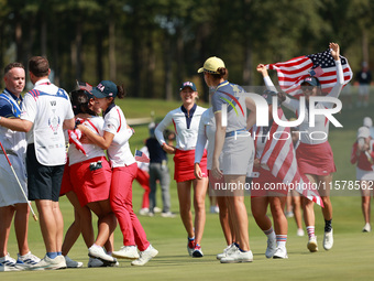 GAINESVILLE, VIRGINIA - SEPTEMBER 15: Team USA players celebrate after winning the Solheim Cup at Robert Trent Jones Golf Club on Sunday, Se...