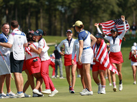 GAINESVILLE, VIRGINIA - SEPTEMBER 15: Team USA players celebrate after winning the Solheim Cup at Robert Trent Jones Golf Club on Sunday, Se...